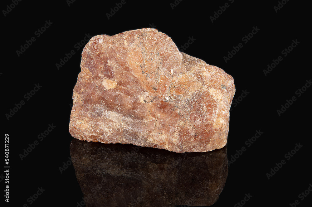 The mineral hessonite is reddish in color with a crystalline structure The mineral hessonite is reddish in color with a crystalline structure