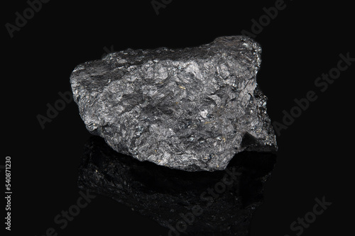 The mineral ilmenite is black in color with a metallic tint and with an uneven surface