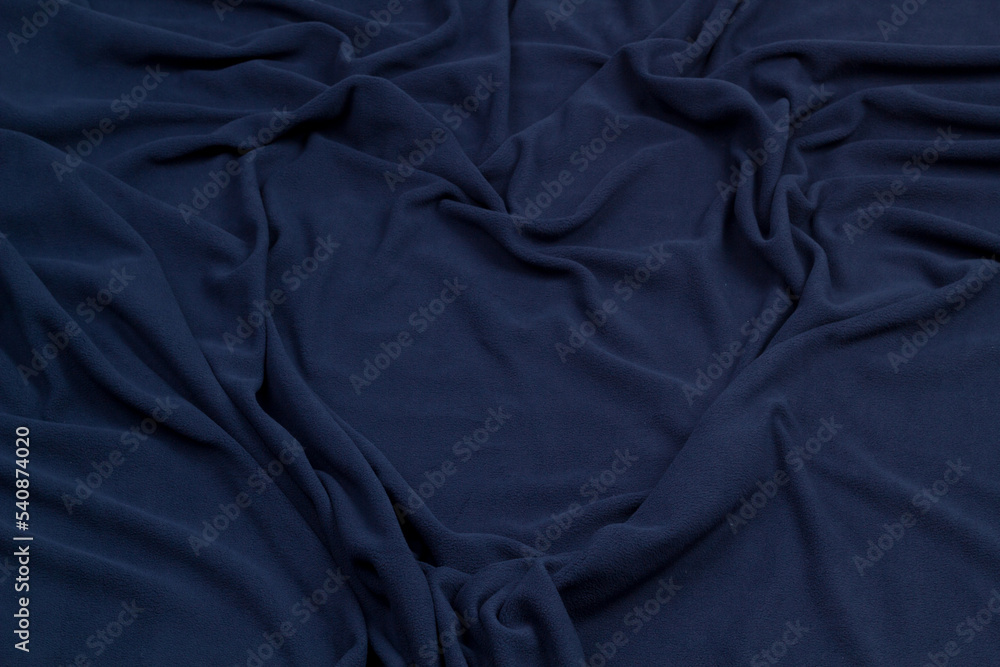 Fleece fabric blue top view. Texture of textile fleece bedspread. Fleece fabric blue top view. Texture of textile fleece bedspread.