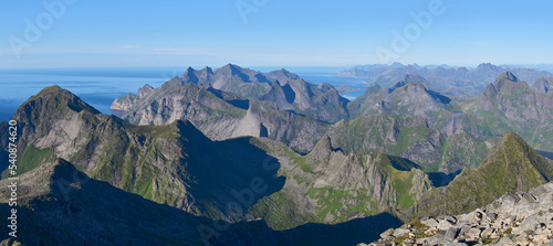 Panoramic view seen from the top of mount Hermannsdalstinden, the highest in Moskenes island and popular hiking destination - fjords, mountains, sea in nearly every direction. Vacation in Lofoten.