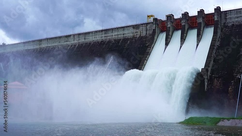 Hydroelectric dam Floodgate with flowing water through gate and Open the springway Khun Dan Prakan Chon Dam in nakhon nayok Thailand photo