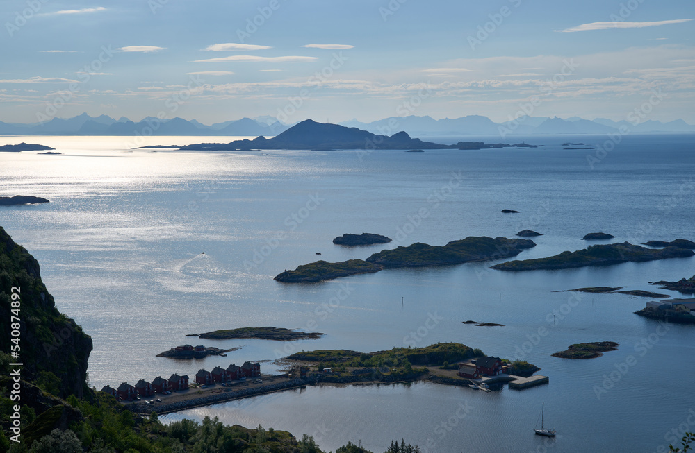 Sunrise above Vestfjorden seen from hiking trail to mount Floya, with the western part of the mainland Norway wall visible at background. Rorbu of Svolvaer at foreground. Sunrise above Vestfjorden seen from hiking trail to mount Floya, with the western part of the mainland Norway wall visible at background. Rorbu of Svolvaer at foreground.