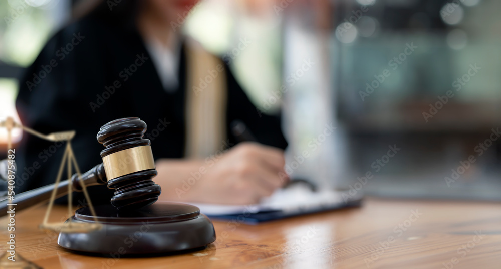 Wooden judge gavel on the table. Lawyer working in office. Law and justice concept. Wooden judge gavel on the table. Lawyer working in office. Law and justice concept.