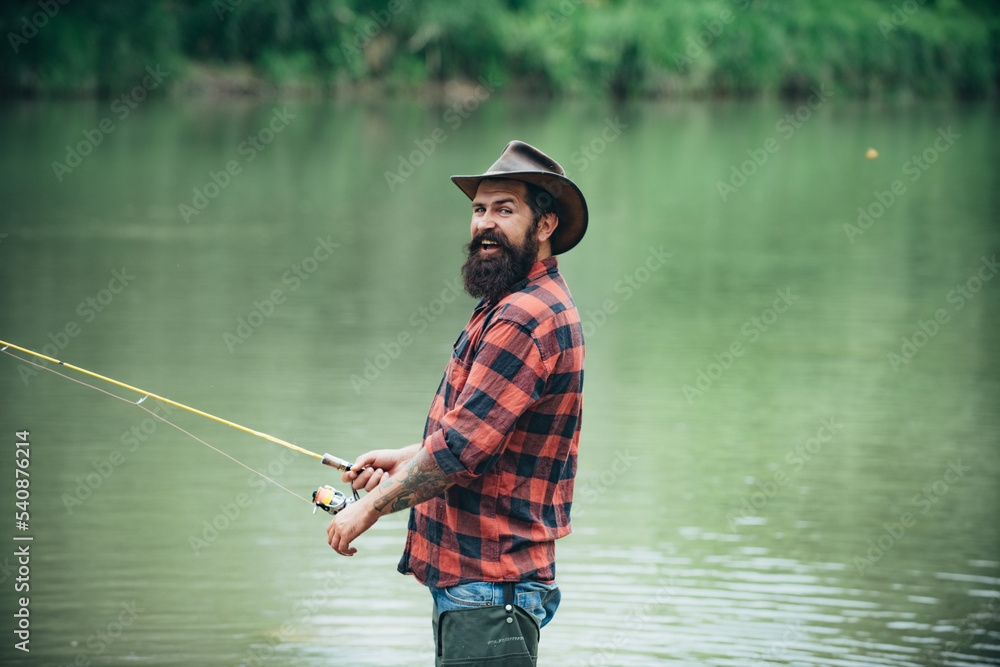 Fisherman using rod flyfishing in mountain river. A fly fisherman fishing for wild trout on the river in the forest.