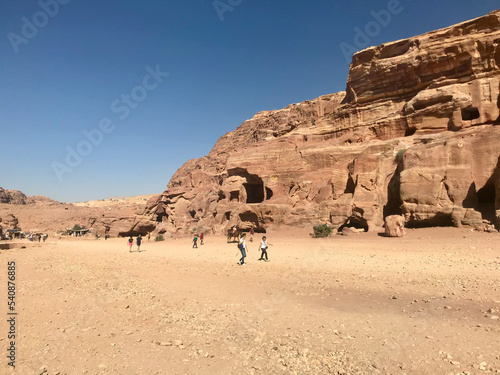Petra, Jordan, November 2019 - A group of people in a desert