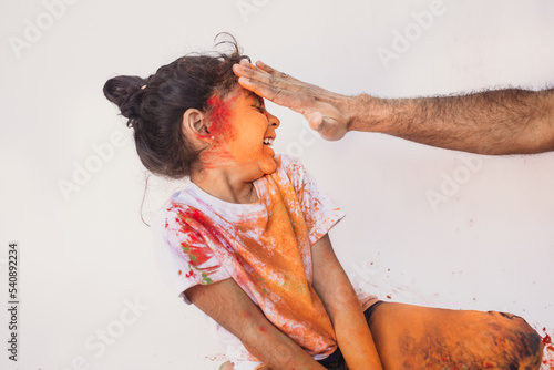 Girl laughing during holi celebration