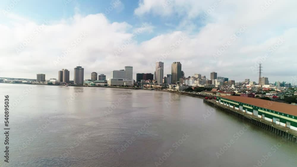 Aerial Shot Of Tall Buildings By Ocean Against Cloudy Sky - New Orleans, Lousiana