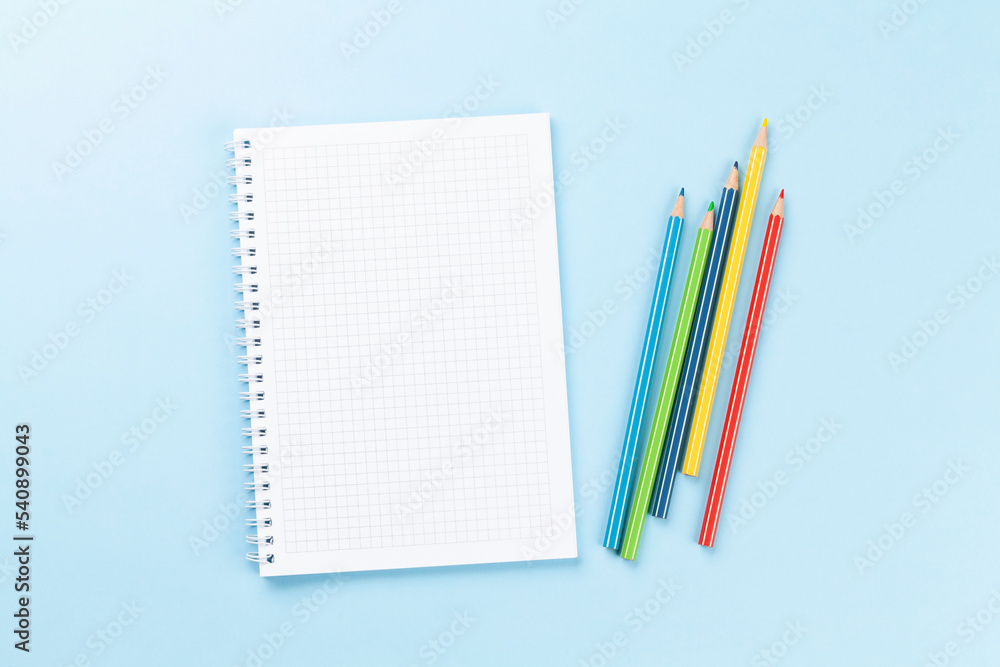 Blank notepad and colorful pencils. Flat lay Blank notepad and colorful pencils. Flat lay