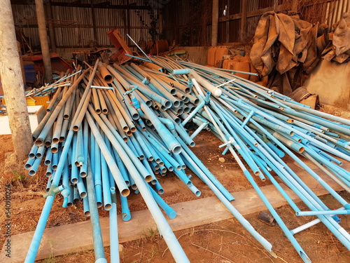 Plastic waste solution dump pile, Industrial scrap plastic on garbage shed, A lot of waste to be reused in the plastics industry, industrial waste background, plastic pipe waste.