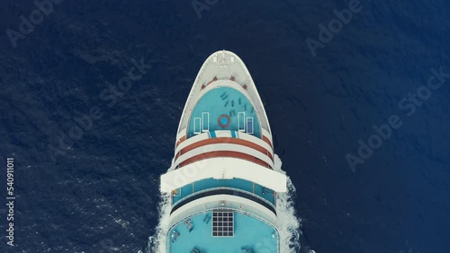 Cruise ship large commercial passenger liner sailing in ocean aerial top view