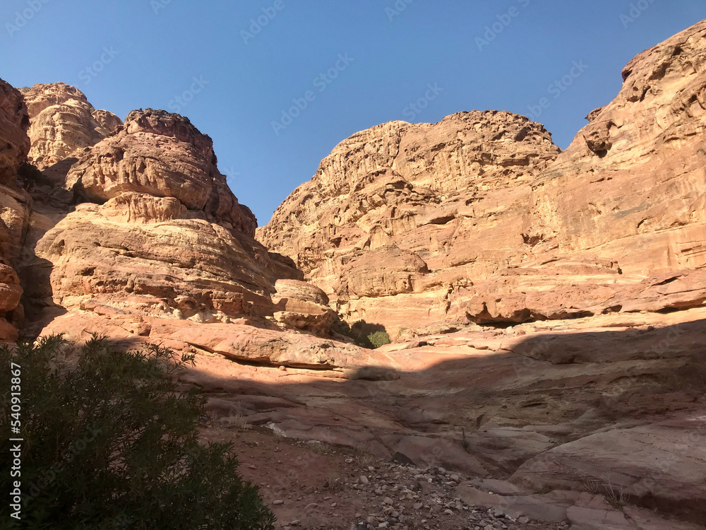 Fototapeta premium Petra, Jordan, November 2019 - A canyon with a mountain in the background