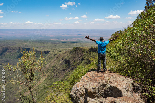 Rear view of a hiker against the background of the volcanic crater on Mount Suswa in Kenya