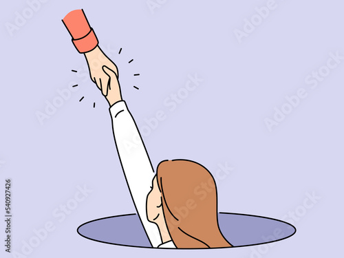 Person give helping hand to woman in hatch 