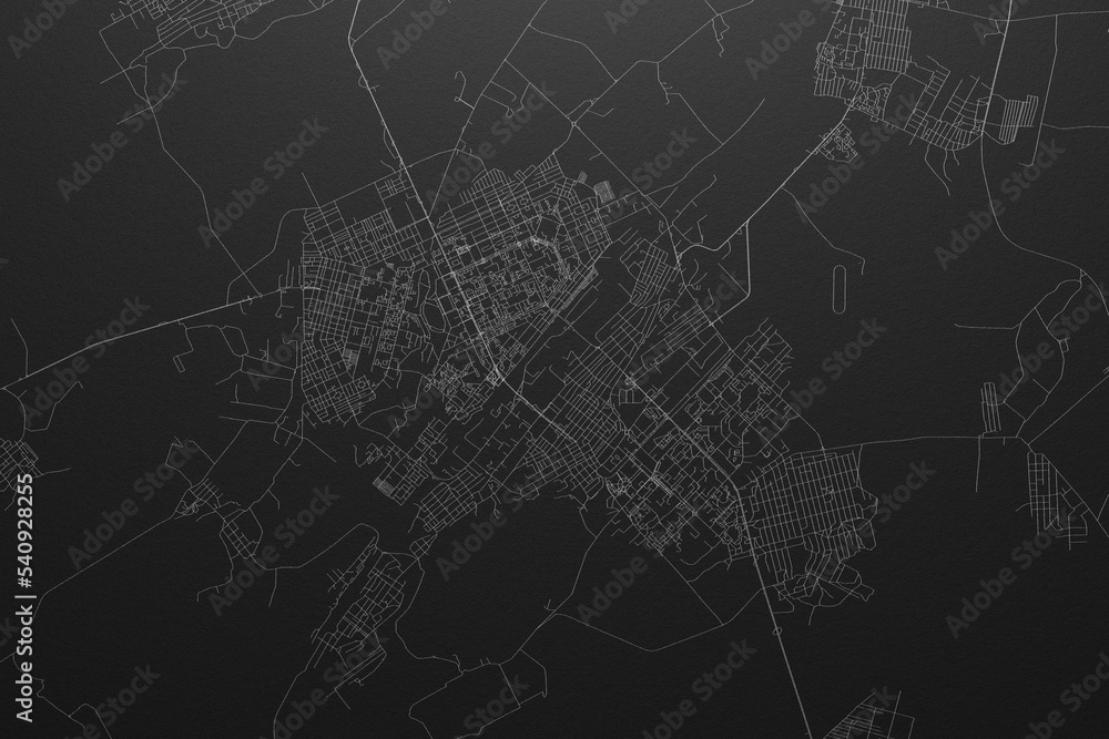 Street map of Karaganda (Kazakhstan) on black paper with light coming from top