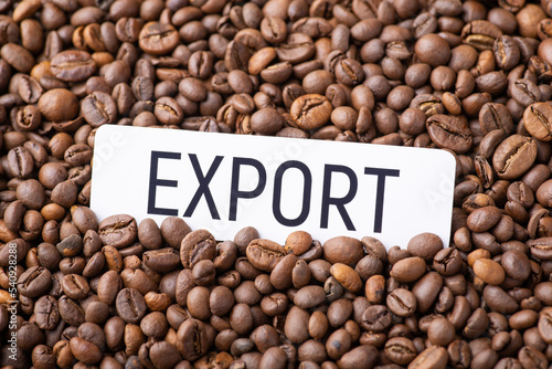 Paper with inscription Export on coffee beans. Conceptual photo of export of coffee around the world  trade of aromatic beverage
