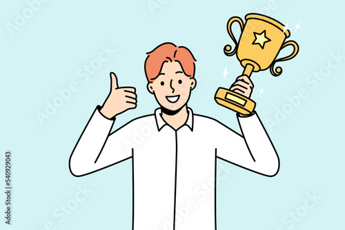 Overjoyed young man with gold prize in hands celebrate win. Smiling businessman with golden award or trophy show thumb up. Vector illustration. 