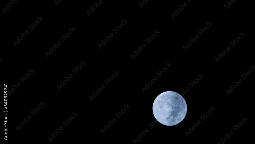 Full moon with moving black clouds. Nighttime timelapse. Clouds floating through the bright disk of the moon. Mysterious night scene Full moon with moving black clouds. Nighttime timelapse. Clouds floating through the bright disk of the moon. Mysterious night scene