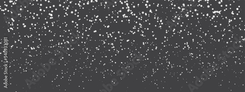 Abstract winter background from snowflakes blown by the wind on a black background. Vector illustrator