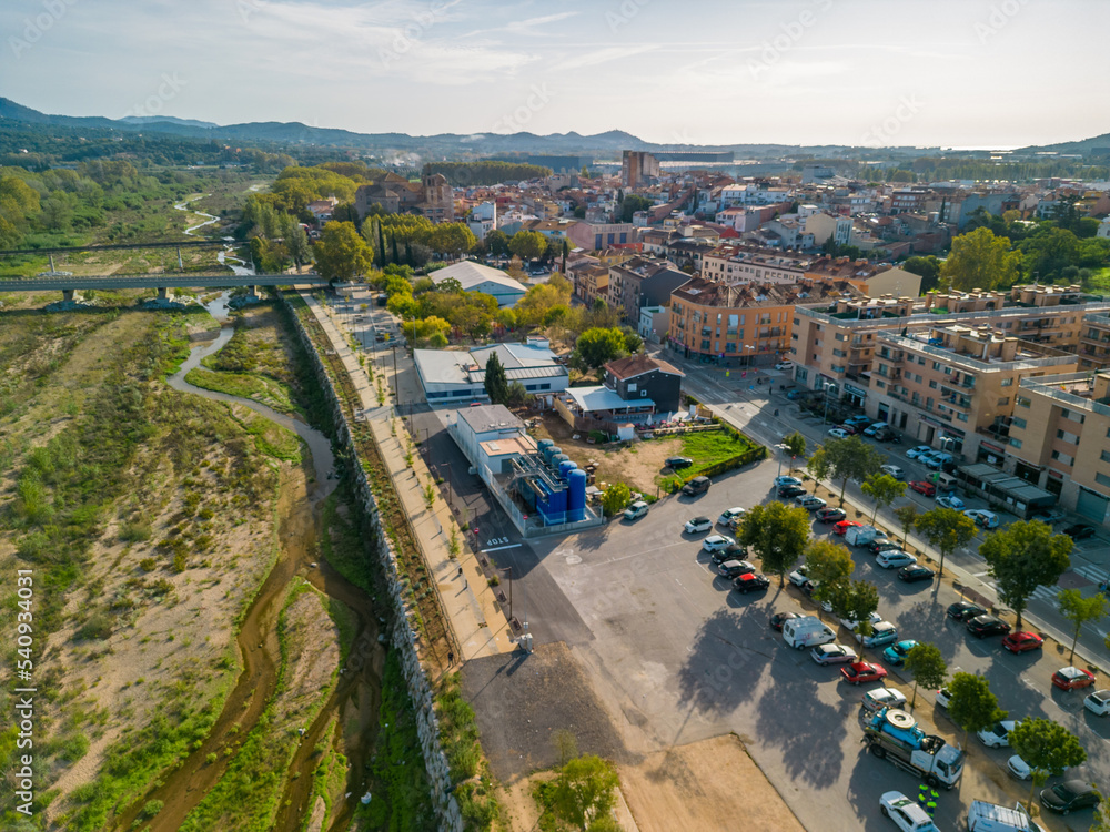 aerial images of the city of Tordera on the Costa Brava old medieval town on the side of a river