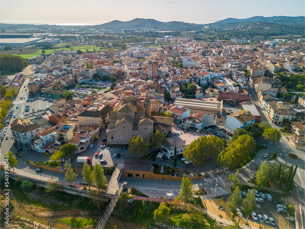 aerial images of the city of Tordera on the Costa Brava old medieval town on the side of a river