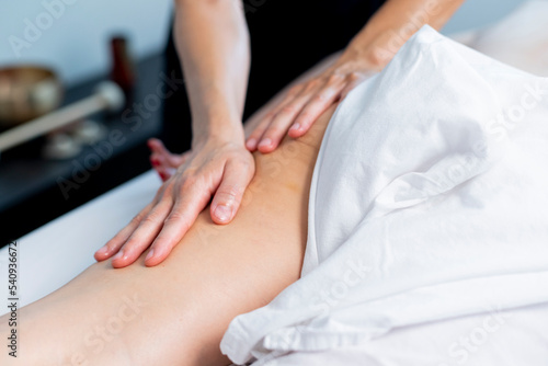 Wallpaper Mural Young woman at the spa receiving a full body massage Torontodigital.ca