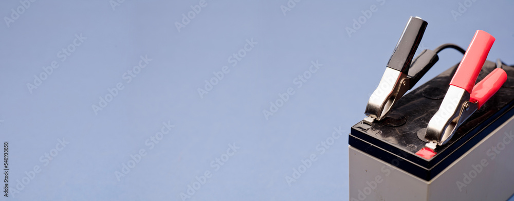 connected bolts charging positive pole and negative pole of battery ...