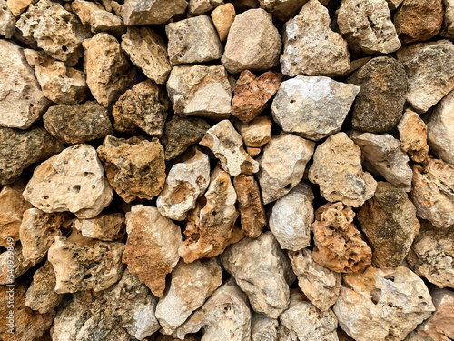 Dry wall background. Jagged rocks stacked on top of each other.
