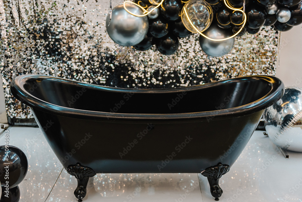 Black bath for photography. A place for a birthday party. Arch or photo ...