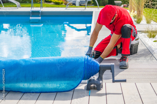 Фотография Technician Finishing Pool Deck Installation