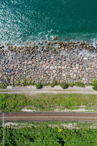 Railway along the sea coast, top view from a drone