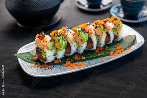 sushi with salmon. Sushi roll with tuna and avocado on a plate