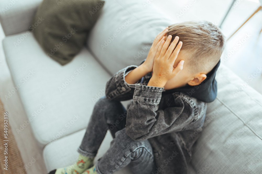 Boy feeling anxiety and stress, kid staying home, child bored and tired. Sad child, stress and depression, autism, pain, sorrow. Alone child boy fear stressful depressed emotion. Boy feeling anxiety and stress, kid staying home, child bored and tired. Sad child, stress and depression, autism, pain, sorrow. Alone child boy fear stressful depressed emotion.