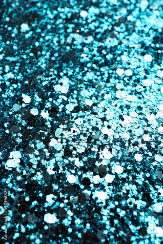 Shiny bright light blue glitter as background, closeup