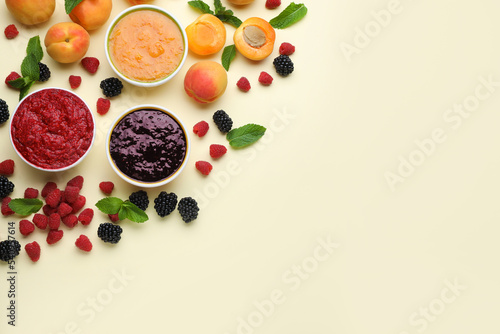 Different puree in bowls and fresh ingredients on beige background  flat lay. Space for text