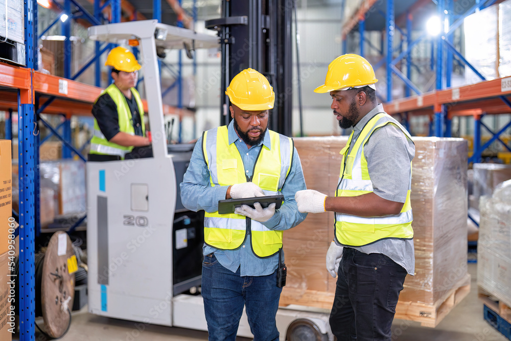 African american working in warehouse hold tablet check list perform ...