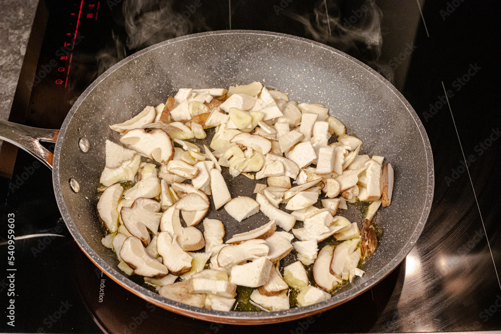 Cooking at home, sauteed boletus edulis with garlic Cooking at home, sauteed boletus edulis with garlic