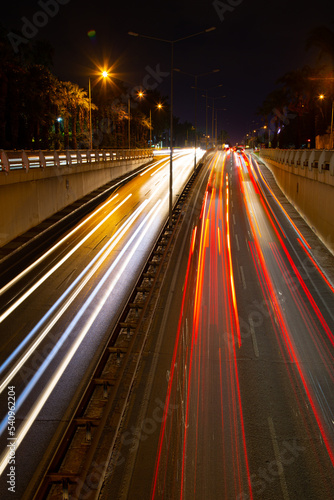 Night traffic, car lights at night on a city street