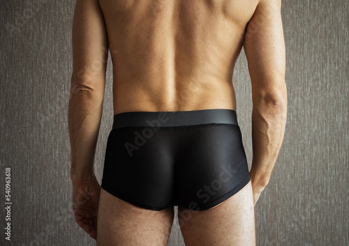 Back and buttocks of young sporty man