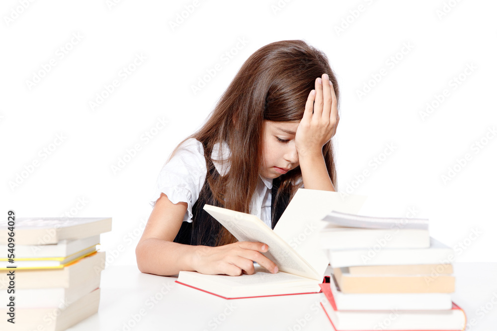 Tired little child girl sleeping on the desk at school. Tired little child girl sleeping on the desk at school.