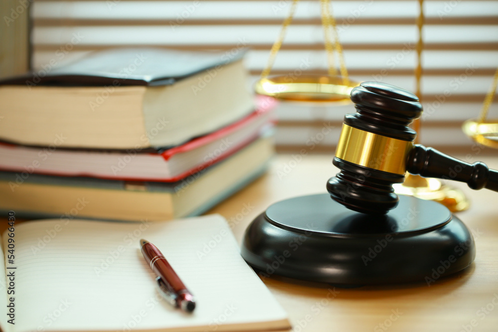 Lawyer or judge's hammer in the court. Auction's hammer and judgement golden scale are on wood table. Law subject. Judgement subject to judge people. Lawyer or judge's hammer in the court. Auction's hammer and judgement golden scale are on wood table. Law subject. Judgement subject to judge people.