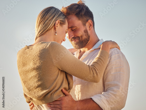 Love, couple and being happy for marriage, romantic vacation and smile together for anniversary. Romance, man and woman doing embrace, holding each other and being intimate for relationship on travel