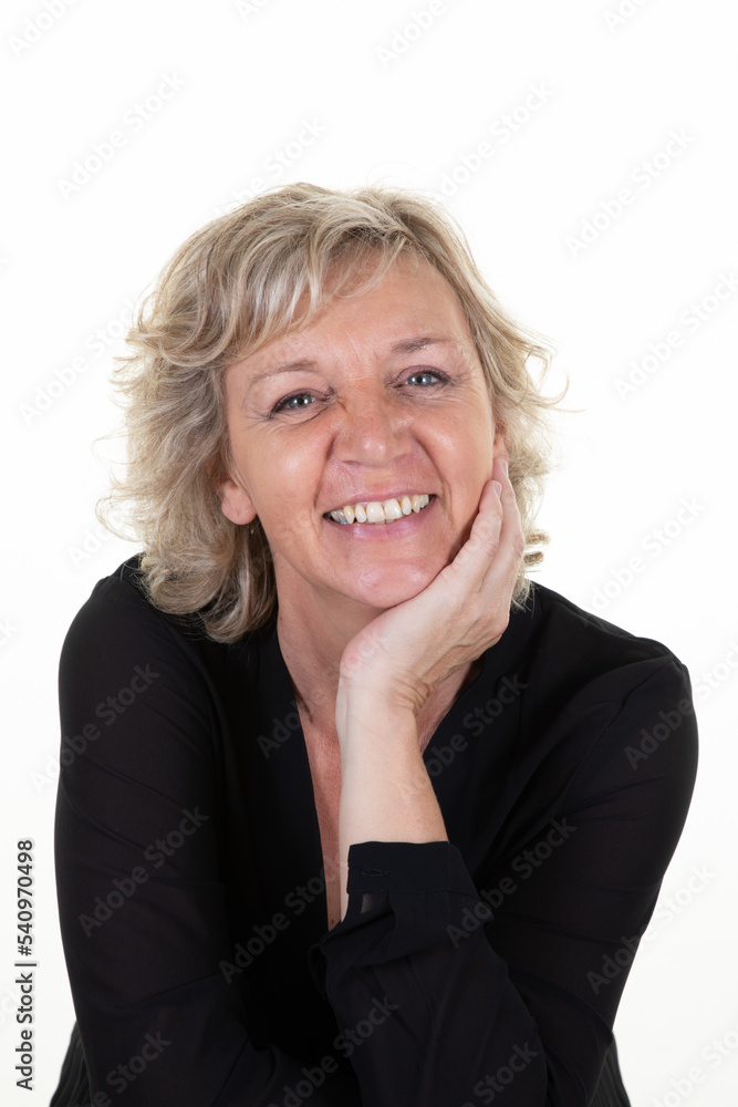Pretty smiling senior woman with blond hair elderly woman hand on chin on white background Pretty smiling senior woman with blond hair elderly woman hand on chin on white background