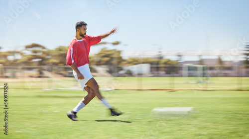 Soccer, sports and fitness with a man athlete playing a game or match on a grass pitch outdoor in summer. Football, training and exercise with a male soccer player at practice for a competitive sport © Beaunitta V W/peopleimages.com