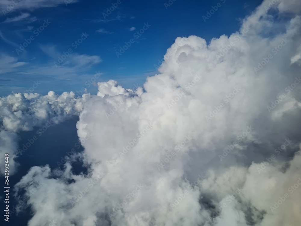 evocative image of clouds seen from an airplane evocative image of clouds seen from an airplane