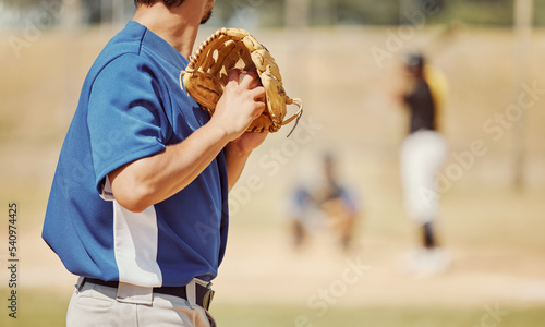 Baseball, sports and pitcher with a ball and glove to throw or pitch at a match or training. Fitness, softball and man athlete playing a game or practicing pitching with equipment on outdoor field.