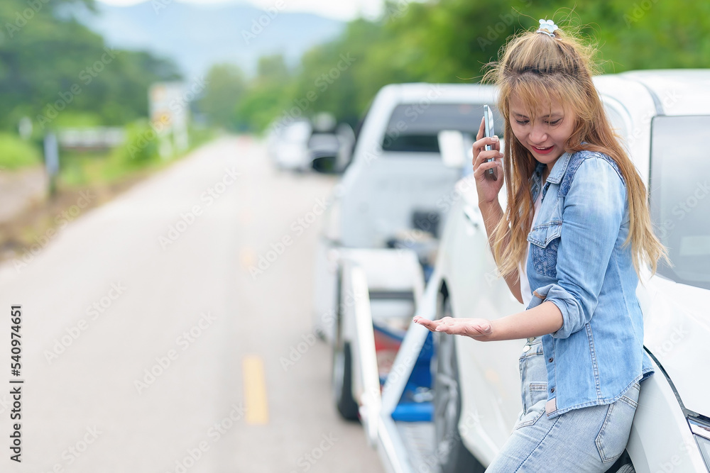 Caucasian Woman Driver Making Phone Call To Insurance Agent After Traffic Accident. Accident. Car insurance an non-life insurance concept.
