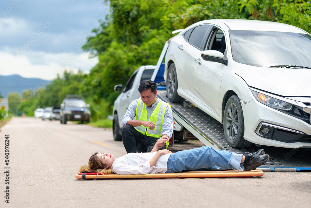 An injured woman in a plastic stretcher after a car accident ,Car accident insurance concept