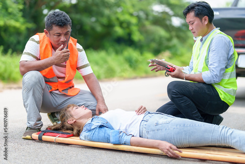 An injured woman in a plastic stretcher after a car accident ,Car accident insurance concept