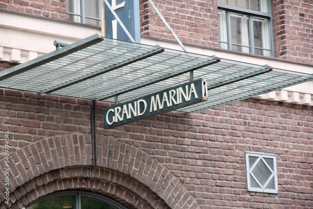 Naklejka premium Helsinki, Finland, February 2018 - A sign on a brick building