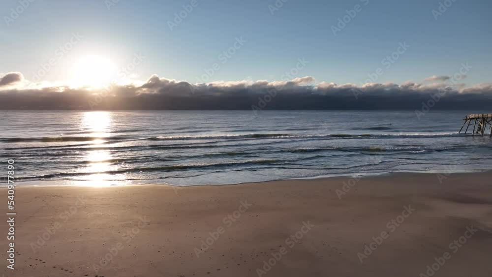 Sunrise over ocean along coastal South Carolina at Pawleys Island after Hurricane Ian extreme weather strikes coastline Sunrise over ocean along coastal South Carolina at Pawleys Island after Hurricane Ian extreme weather strikes coastline